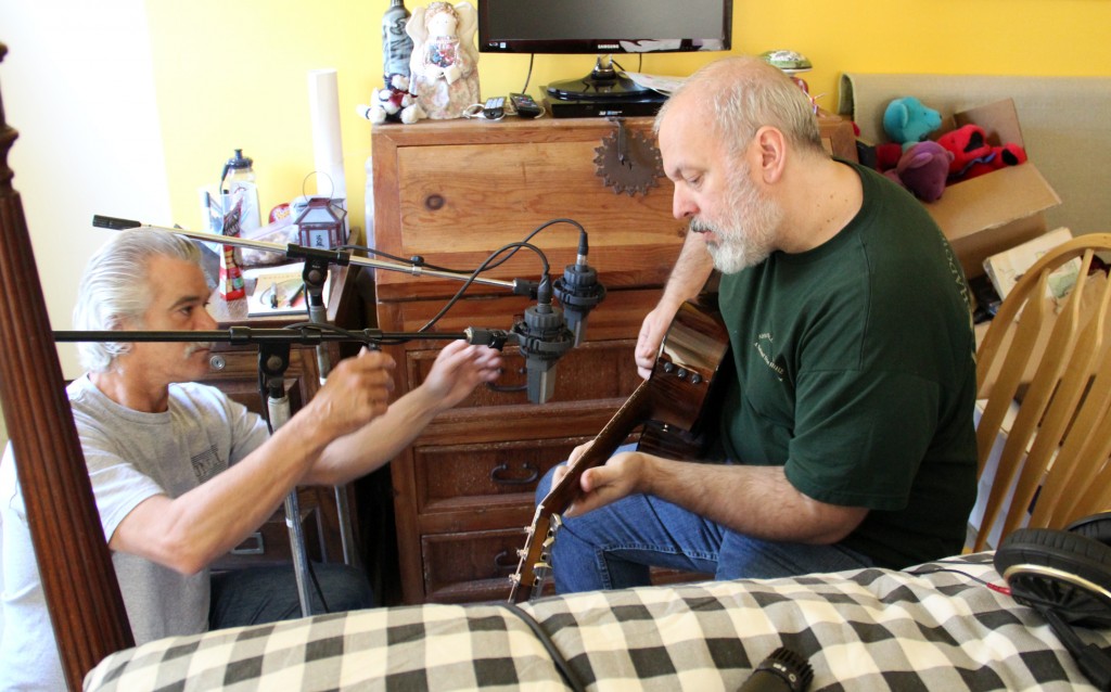 Indispensable engineer Mike Harris adjusts the crucial Exowax AKG 414 microphones before the essential Mike Keneally records some acoustic overdubs on the new and invaluable Taylor 616ce guitar provided by the incomparable Tim Godwin at Taylor Guitars. (Photo by the arguably replaceable Scott Chatfield)